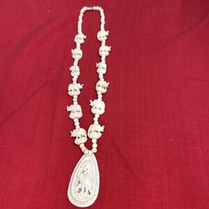 Hand-Carved Elephant Bead Necklace With Ornate Pendant.